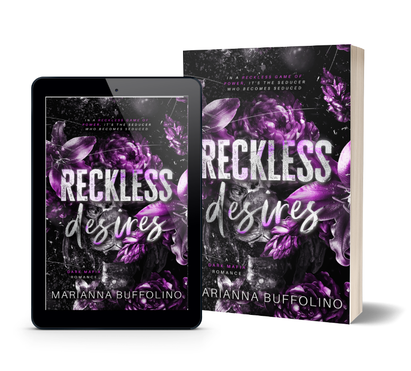 E-book reader and paperback display the cover of Reckless Desires by Marianna Buffolino, featuring bold white text over dark, abstract flowers with purple accents and a dramatic, moody aesthetic.